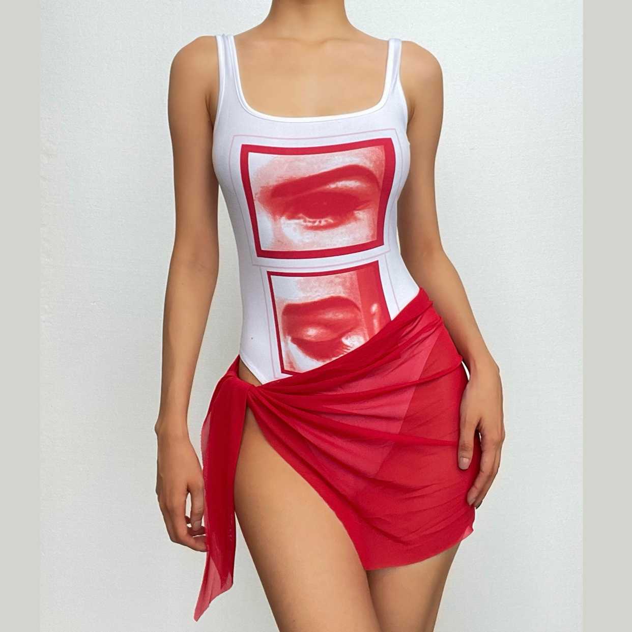 Completo gonna body senza maniche con scollo a rete a contrasto astratto