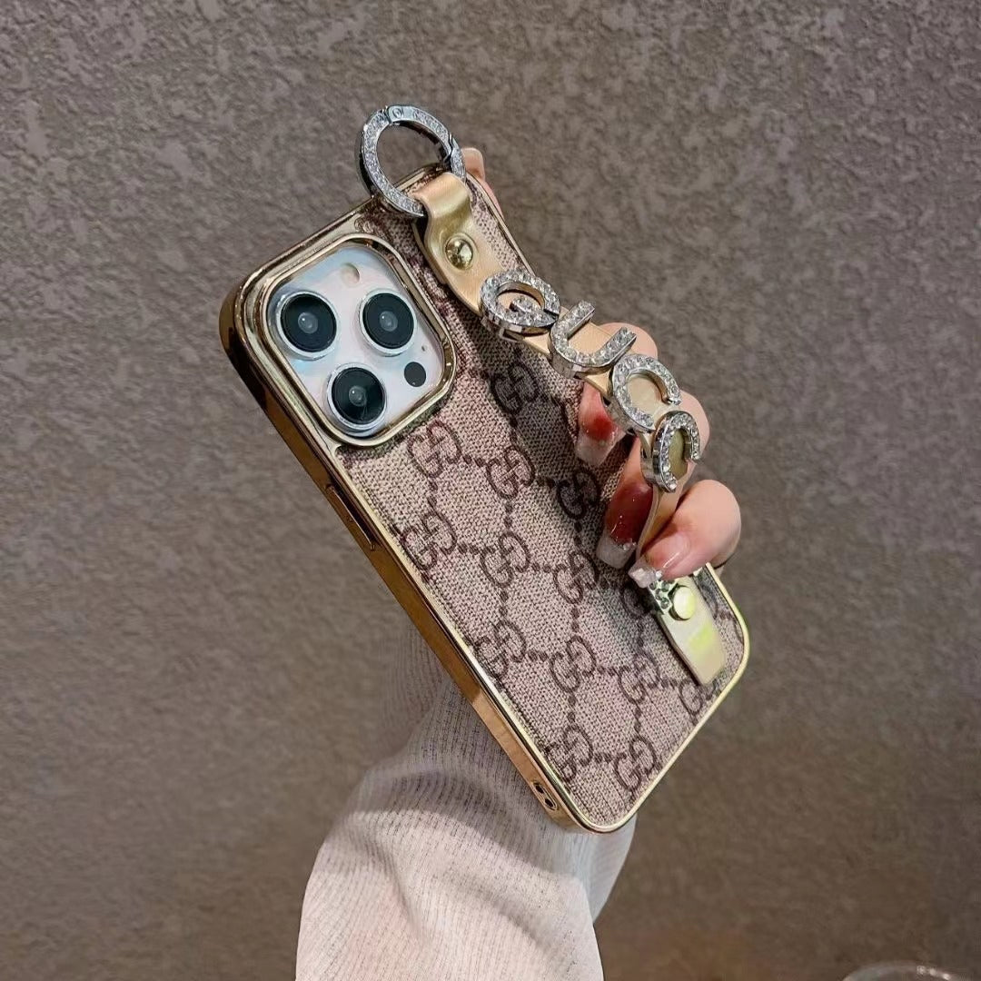 Custodia per telefono con strass dorati per iPhone