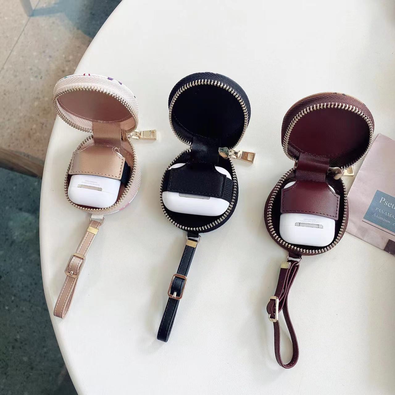 Custodia rotonda classica per auricolari colorati