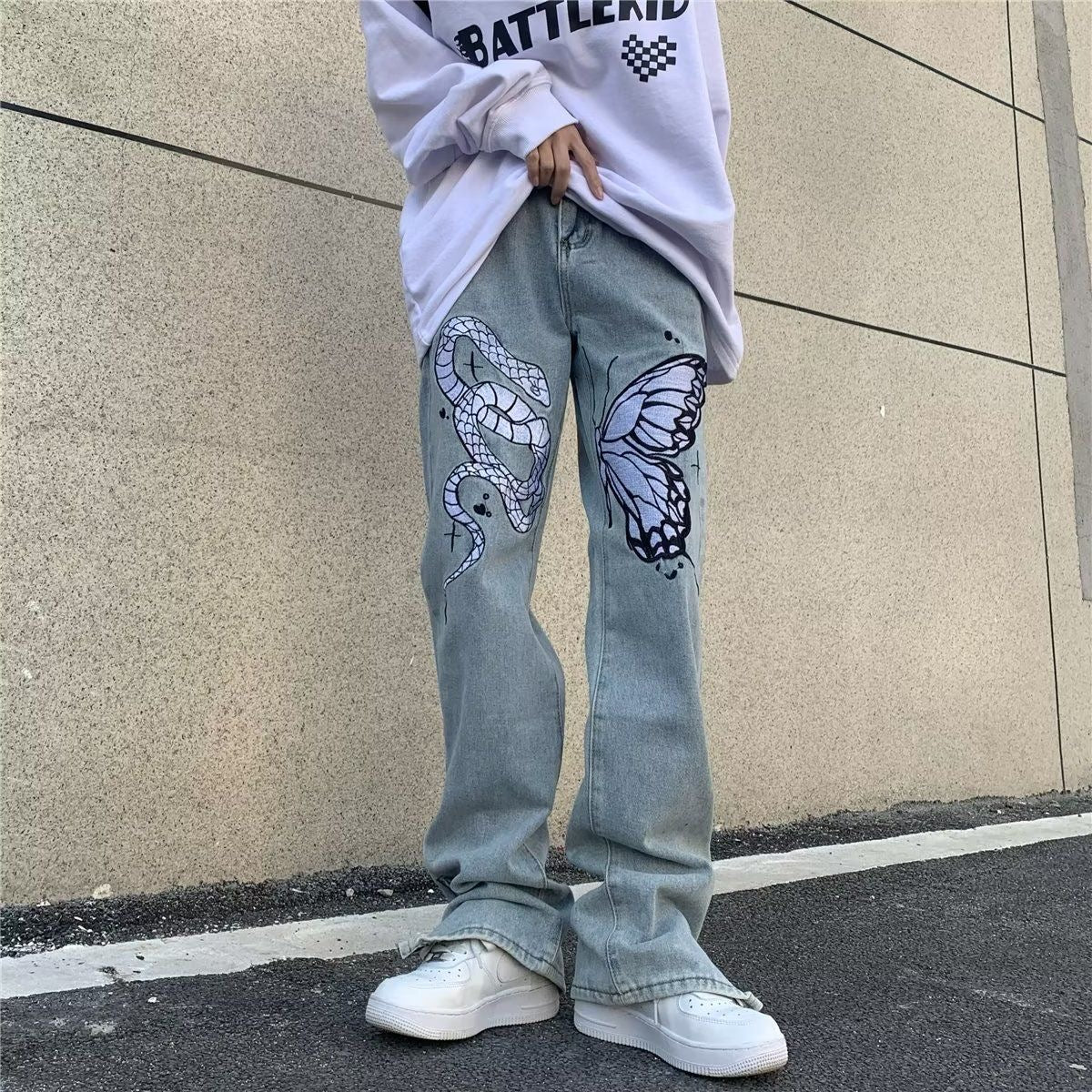 Jeans a gamba larga sbiaditi a vita bassa