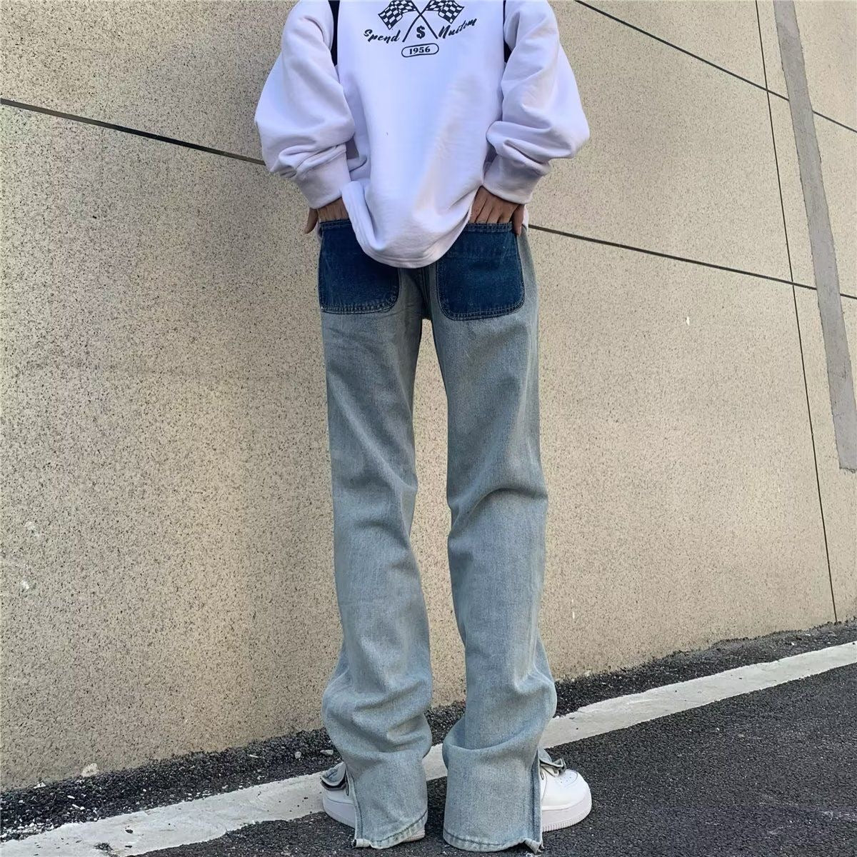 Jeans a gamba larga sbiaditi a vita bassa