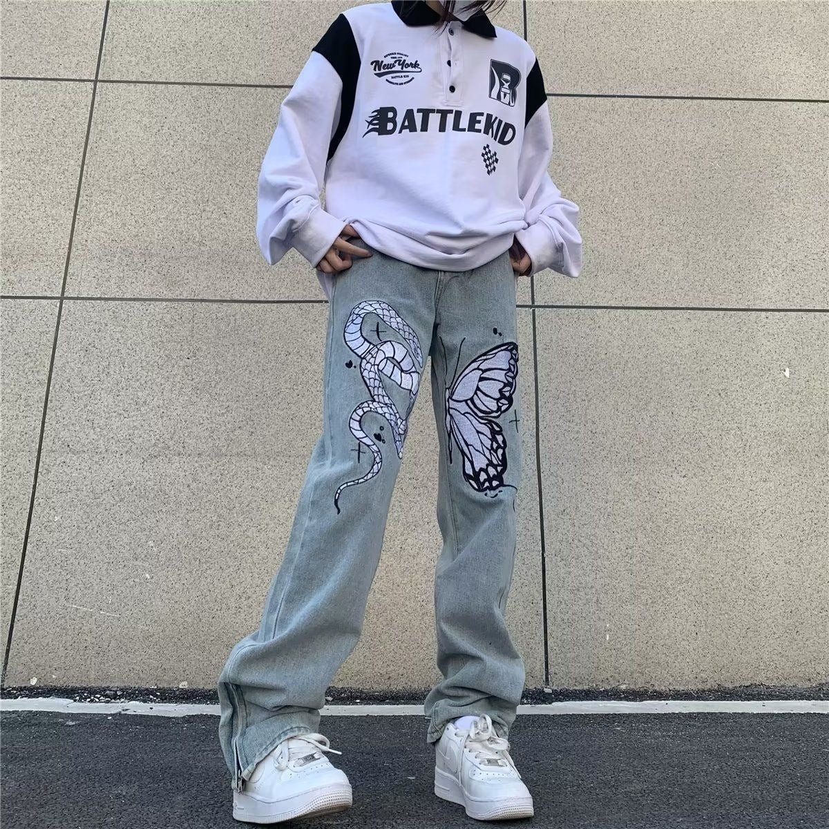 Jeans a gamba larga sbiaditi a vita bassa