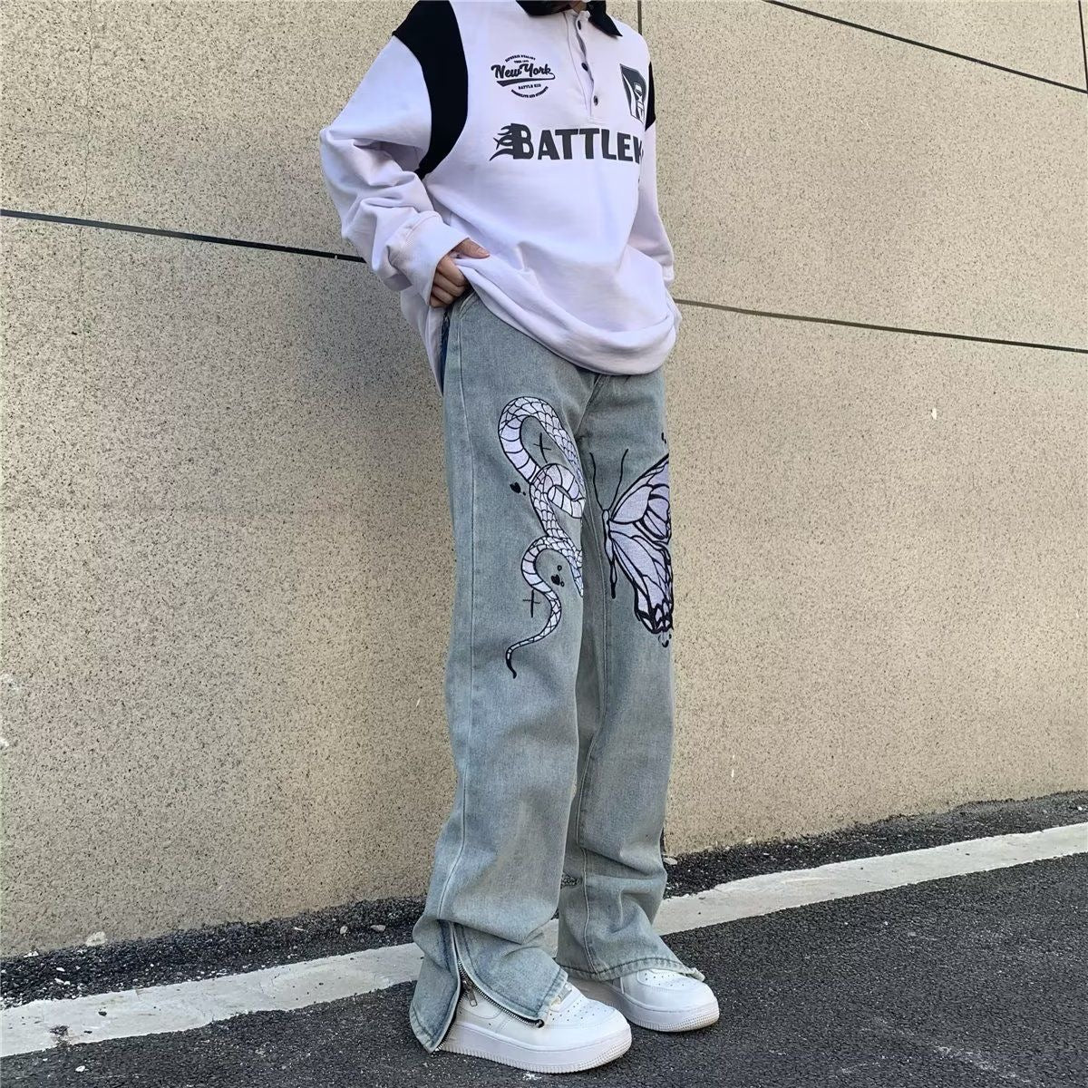 Jeans a gamba larga sbiaditi a vita bassa