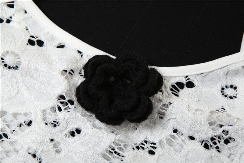 Top corto trasparente con schiena scoperta e applicazioni di fiori in pizzo