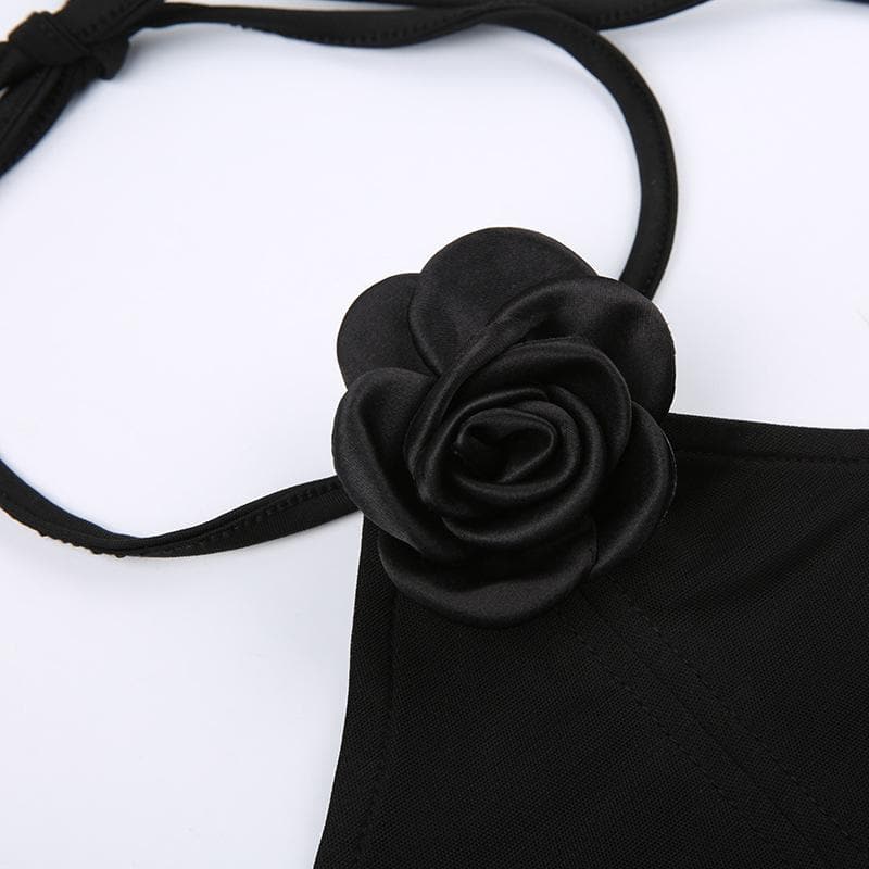 Top corsetto con schiena scoperta e allacciatura a collo alto con applicazioni floreali