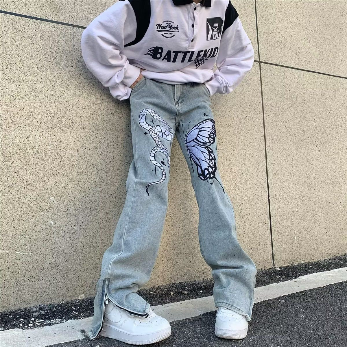 Jeans a gamba larga sbiaditi a vita bassa