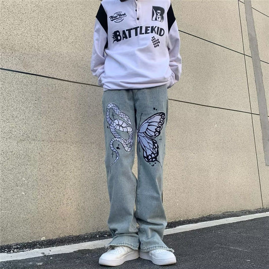 Jeans a gamba larga sbiaditi a vita bassa