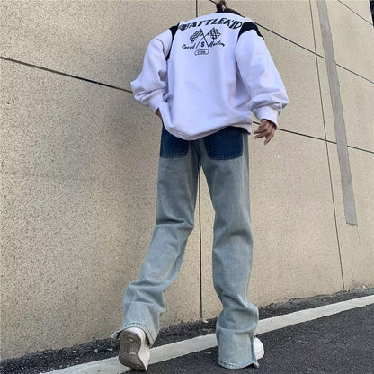 Jeans a gamba larga sbiaditi a vita bassa