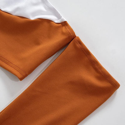 Minigonna a maniche lunghe con spalle scoperte e schiena scoperta, patchwork a contrasto 